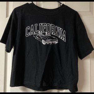 California crop top with skeletons on it color black size large brand Zumiez